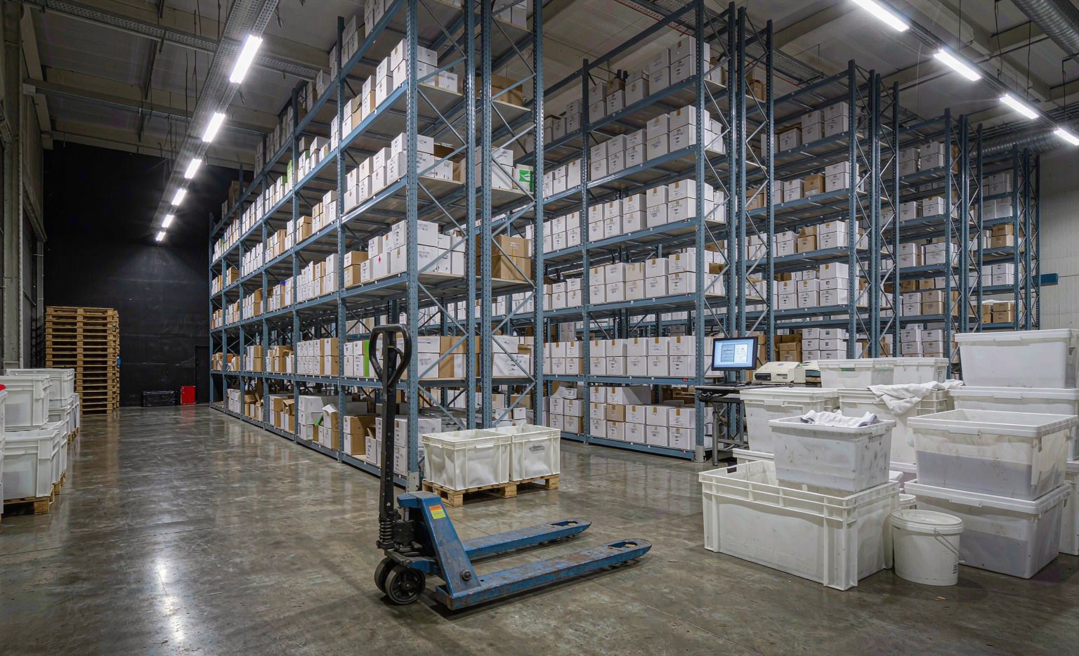3PL distribution warehouse interior with shelving and packing stations